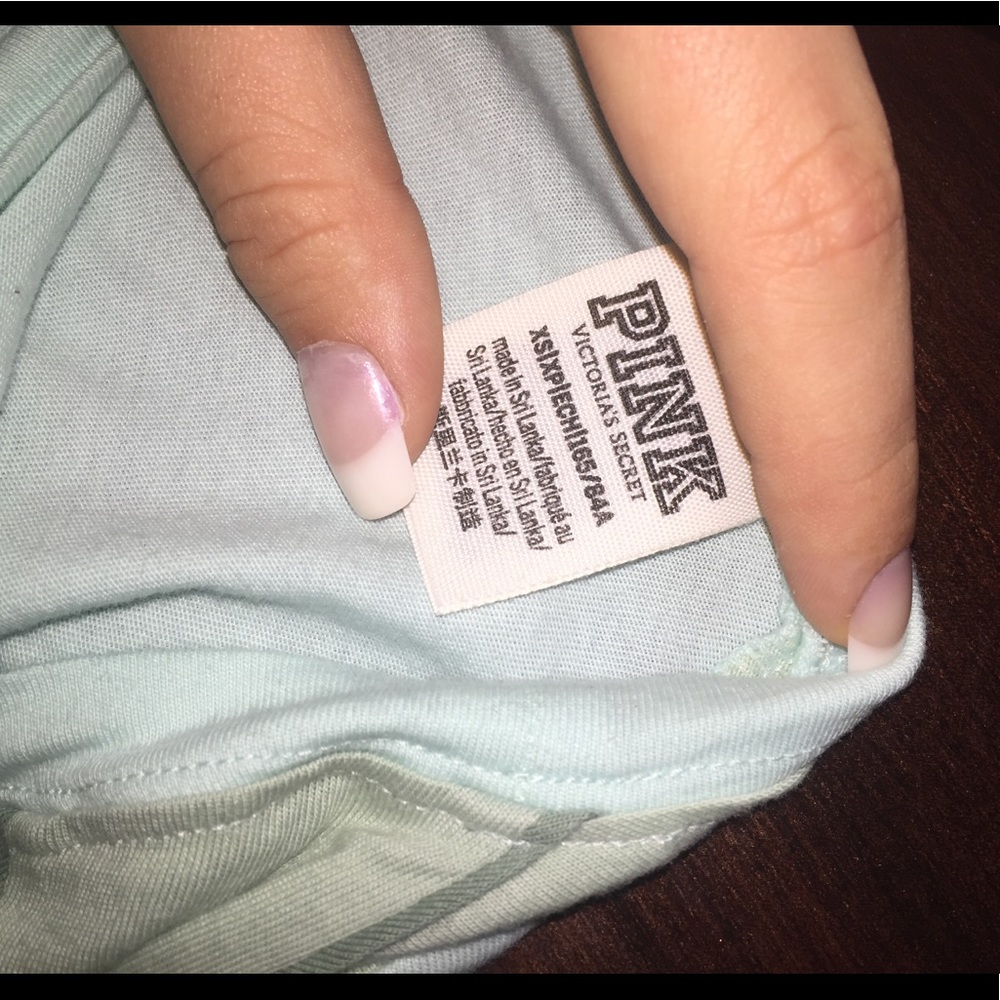 a long sleeve light blue “ pink “ shirt